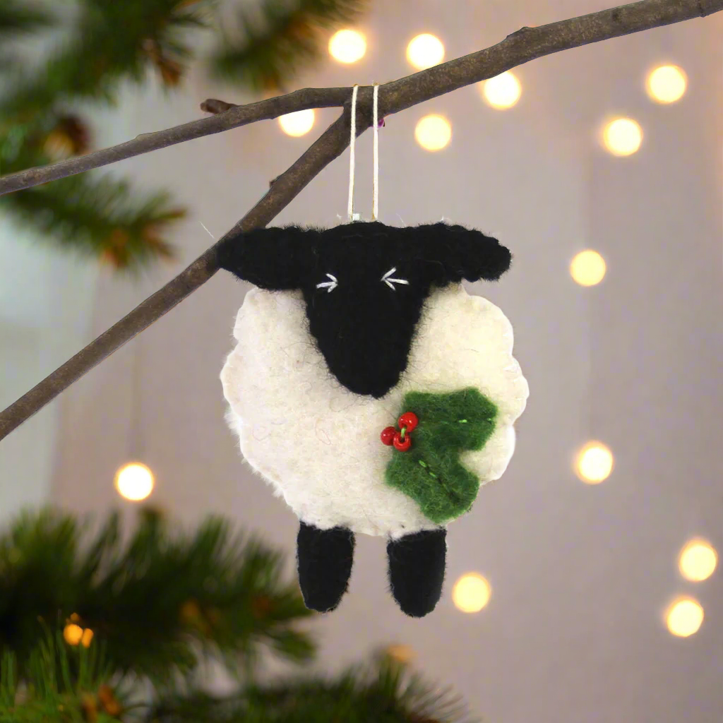 hand-felted black and white sheep holiday ornament made by fair trade artisans in Nepal and fair trade imported to the US. 