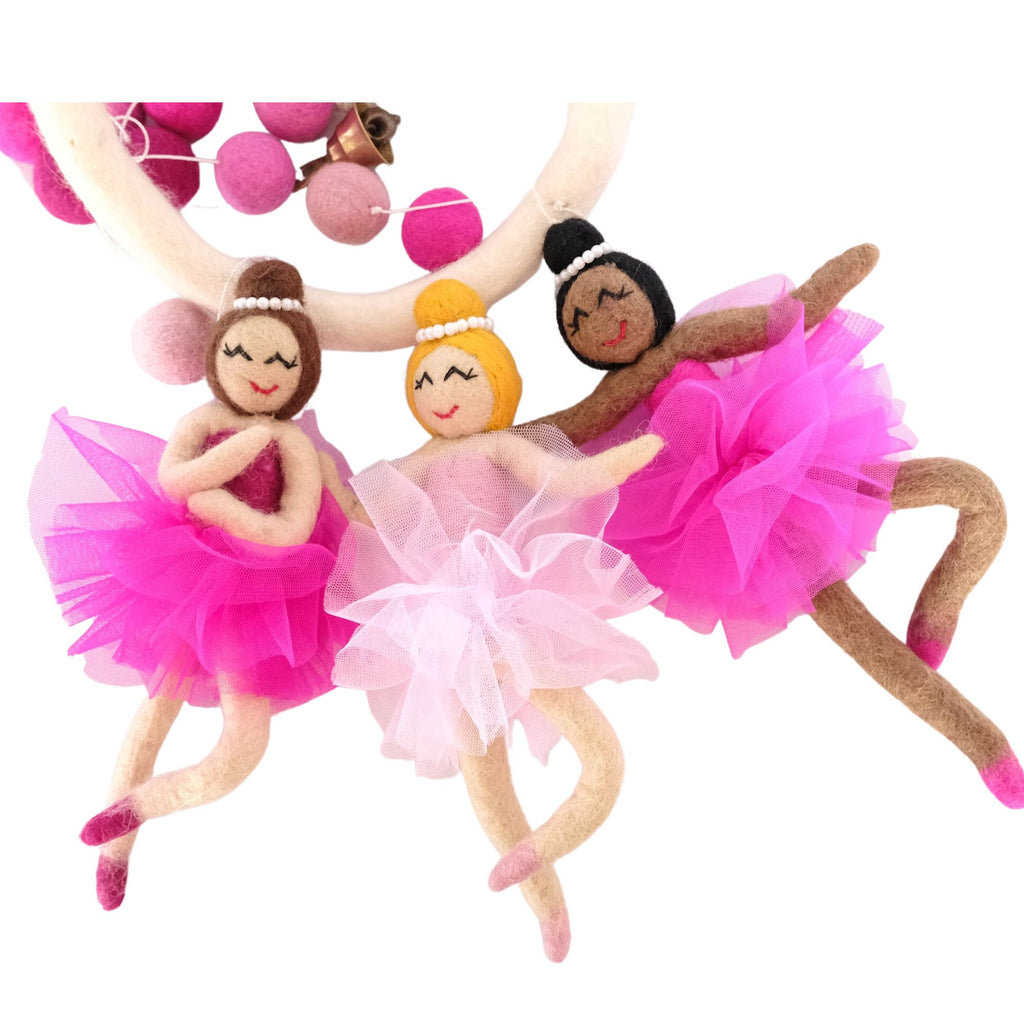 Handcrafted felt mobile with bendable ballerinas for baby nurseries.