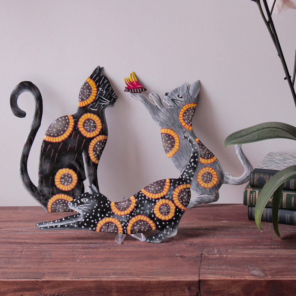 set of 3 cats painted with sunflowers made from recycled metal and fair trade imported from Haiti.