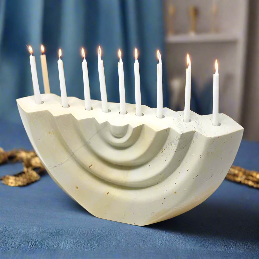 fair trade hand-carved soapstone menorah with nine white lit candles