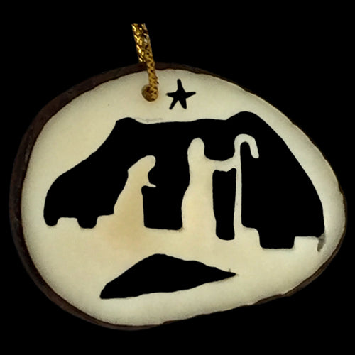 <center>Tagua Nut Mary & Joseph on Bridge Ornament Slice</br>from Ecuador </br>Average Measurement - 1 3\8" high x 1 5/8" wide x 1/8" thick</center>