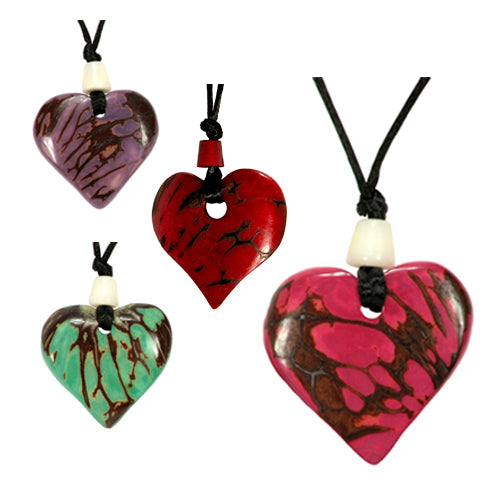 <center>Tagua Heart Pendants - Carved by Artisans of Ecuador </br> Measures: 1-1/2&quot x 1-1/2&quot and cording has an 18&quot drop </center>