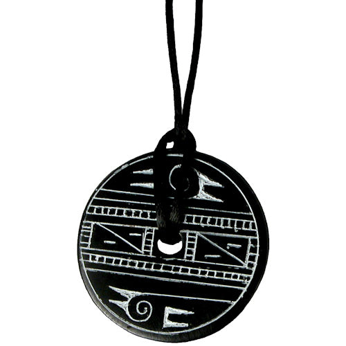 <center>Coal Pendant with Bird Design </br>Crafted by Artisans in Colombia </br>Measures 1-3/4” in diameter and 1/8” deep</center>