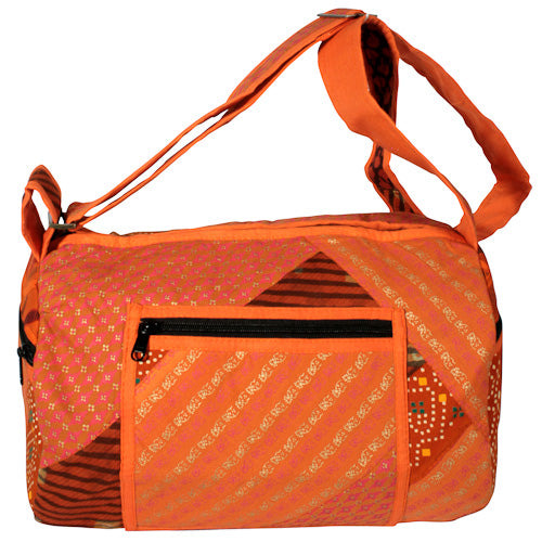 <center>Orange Tone Patchwork Round Bag </br>Crafted by Artisans in India </br>Measures 12-1/2” long x 8-1/2” diameter</center>