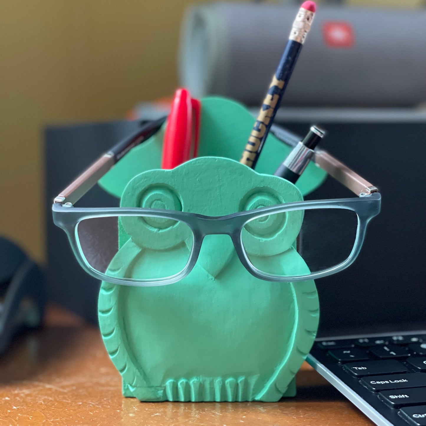 hand carved wooden desk organizer, pen holder, eyeglass holder. Mr. Owl is made from sustainably sourced  mango wood  and is a fair trade product.