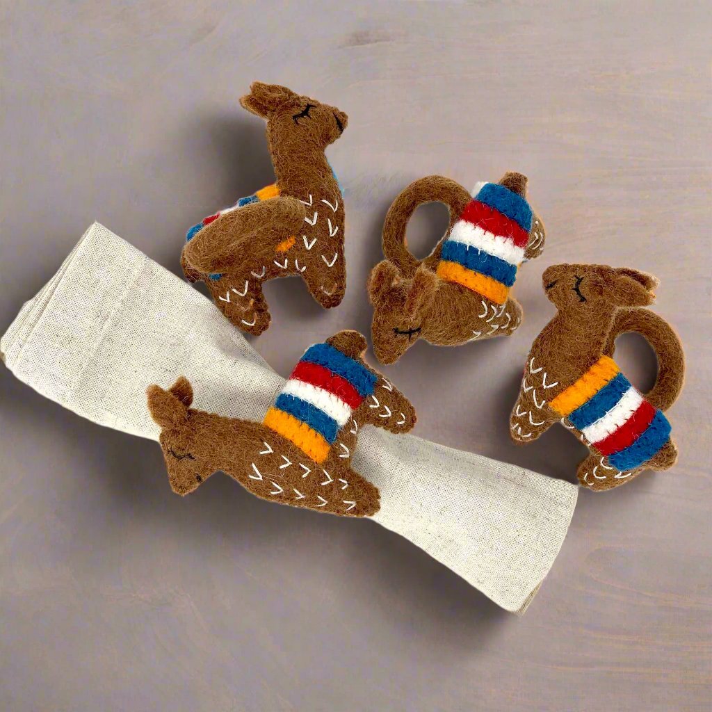 set of 4 hand-felted brown Llama napkin rings made by female artisans in Nepal. Fair trade certified.