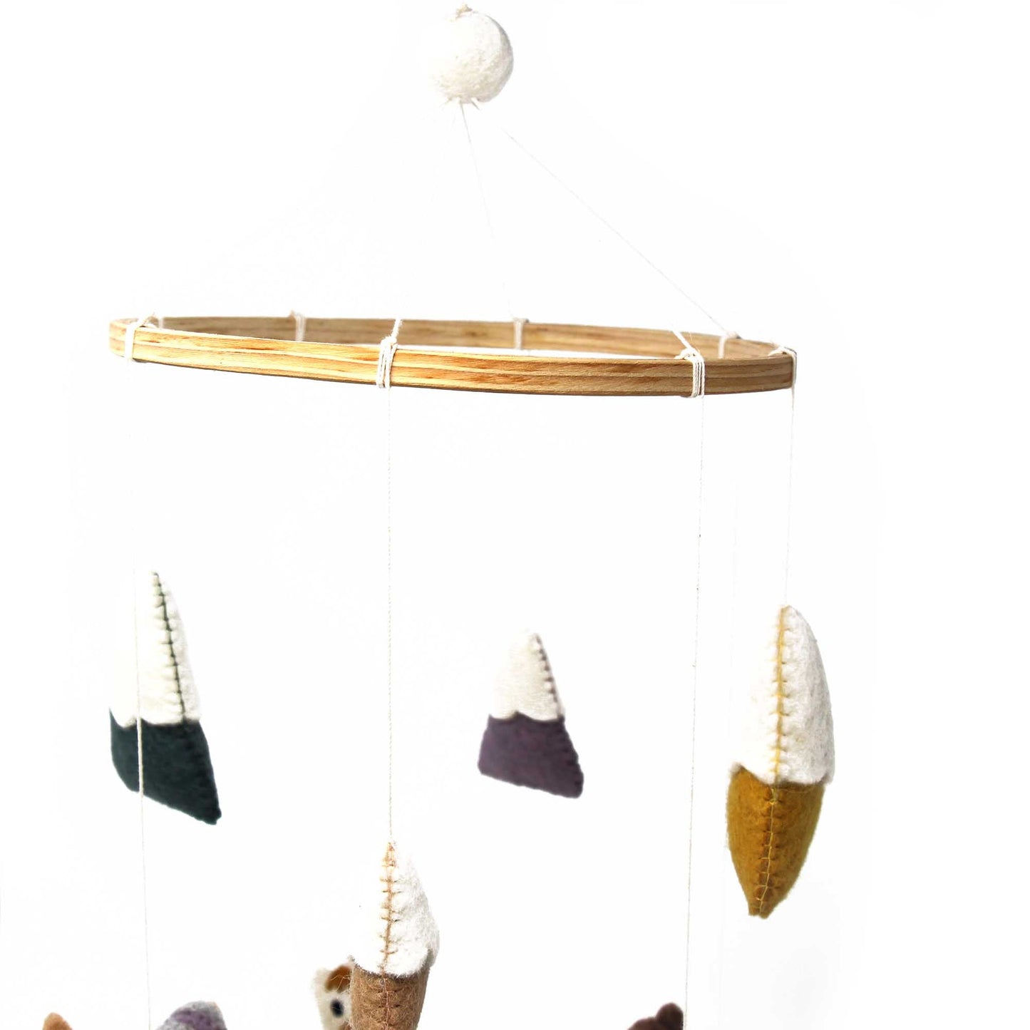 handmade bamboo hoop with llama felt baby mobile created by female artisans in fair trade groups within Nepal and Thailand. 